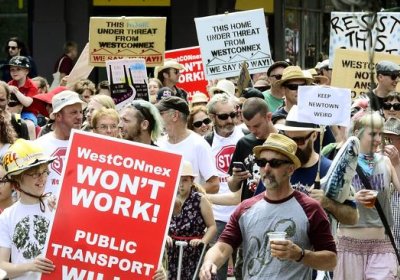 Desmonstrators march through Sydney's streets on February 1 to protest the WestConnex motorway.