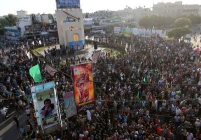 Palestinians gather in the Gaza Strip for a rally against Israeli attacks on August 21. 