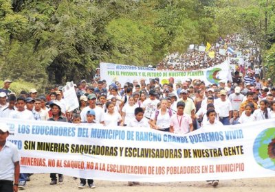 Residents of El Rancho march in protest against the El Pavon mining project.