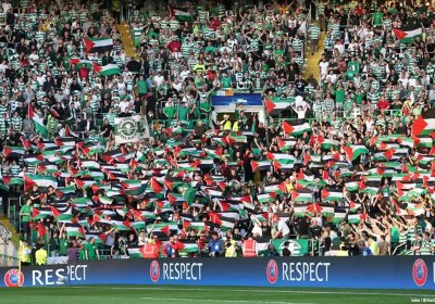 Fans of Scotland’s Glasgow Celtic FC display Palestinian flags.