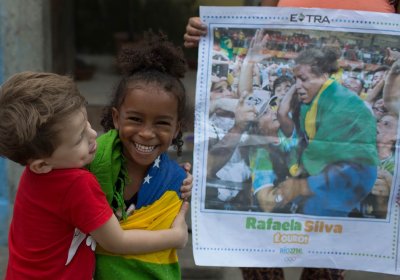 In the City of God favela where she’s from, Rafaela Silva’s cousin is wrapped in a Brazilian flag.