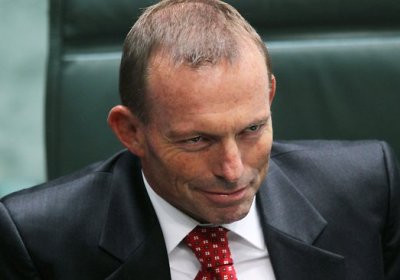 Tony Abbott smirking.