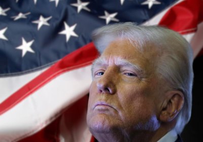 US President Donald Trump. Background: US flag