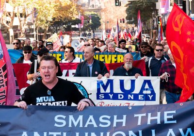 Unionists marching down the street carrying banners and flags.