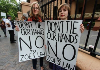 Demonstrators protest against 'Zoe's Law' at Legislative Council Parliament House in Sydney.