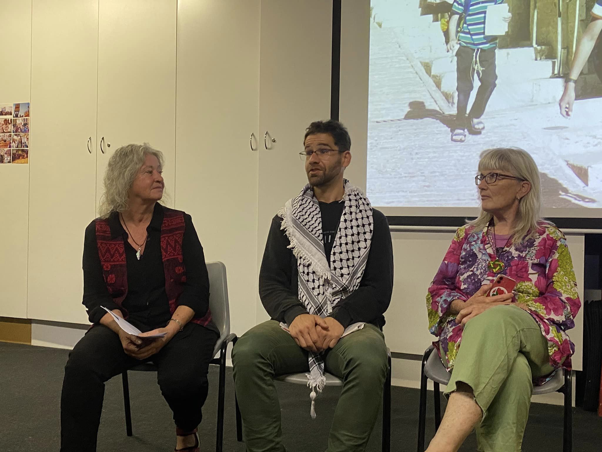 From left: Jill Hickson, Ahmed Abdala and Michelle Berkon discuss the international solidarity movement